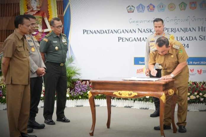 Bupati Tamba Tandatangani NPHD Pengamanan Pilkada 2024