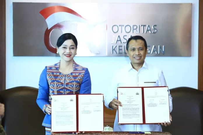 Pejabat Sementara Wakil Ketua Dewan Komisioner OJK Friderica Widyasari Dewi dan Kepala Bareskrim Polri Komisaris Jenderal Polisi Syahardiantono menandatangani kerja sama penanganan tindak pidana di sektor jasa keuangan.